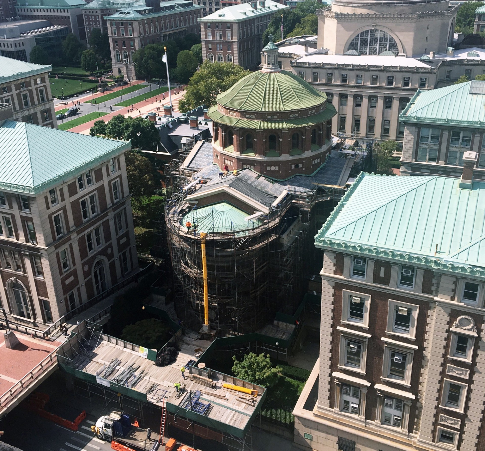 Aerial view of St. Paul's Chapel. The front portion of the chapel is obscured by layers of scaffolding. The new terra cotta tiles for the front roof have not yet been placed.