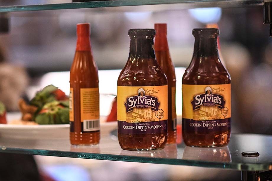 Bottles of Sylvia's hot sauce and BBQ sauce