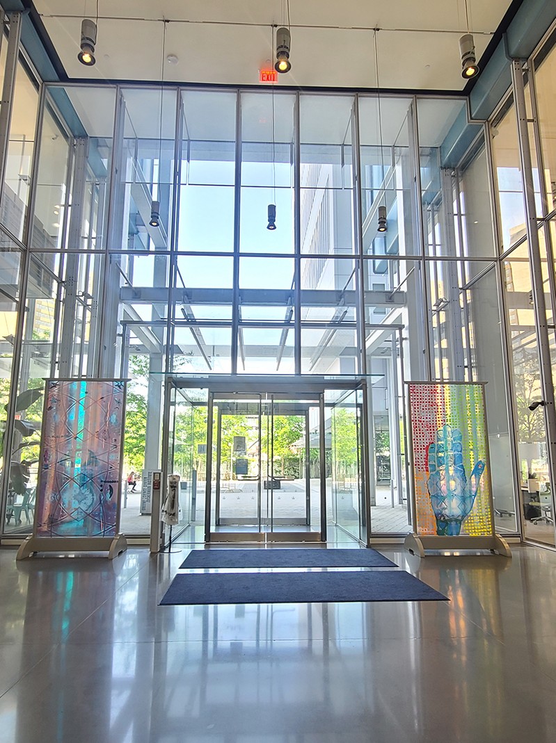 The custom pieces on display in the lobby of the Jerome L. Greene Science Center. The two colorful custom pieces on display in the JLG Science Center lobby on either side of the entry way.