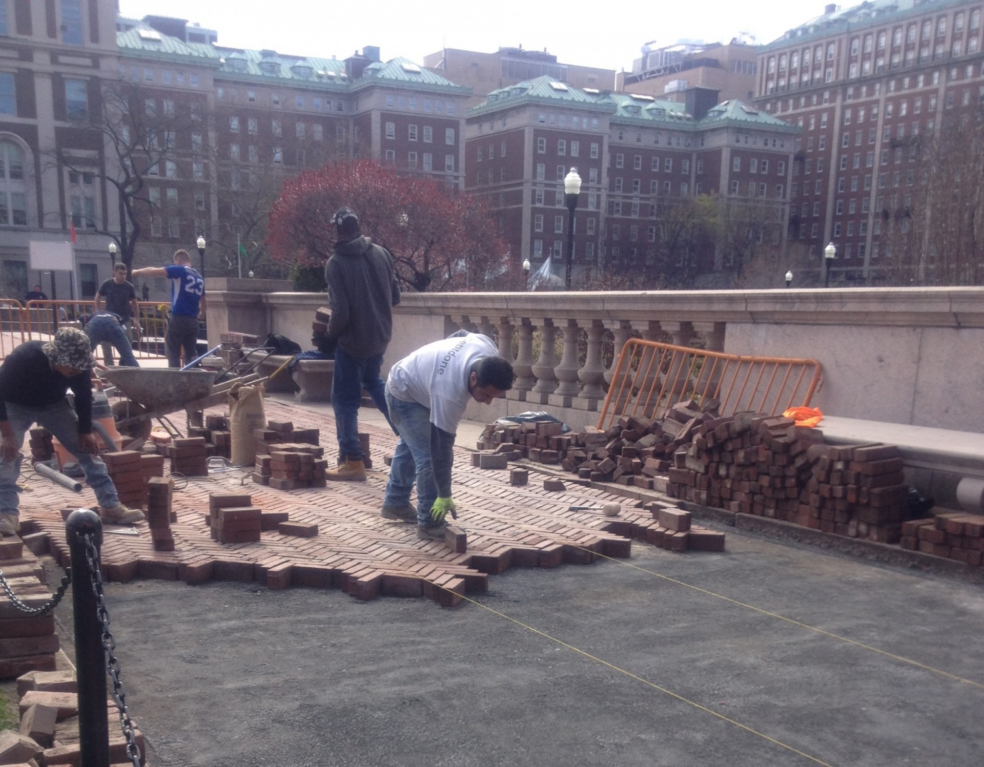 Repairs being made to sections of the brick walkways of College Walk to reduce undulation and replace damaged bricks.
